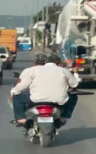 Read more about the article Baffling Moment Bikers Ride Down Road With Pedestal Fan
