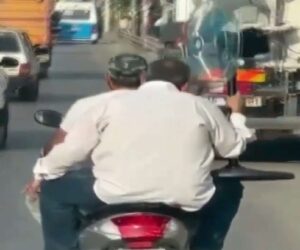 Baffling Moment Bikers Ride Down Road With Pedestal Fan