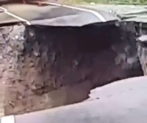  Road Swept Away As Drivers Pose For Pictures